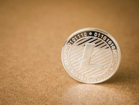 Litecoin on a brown background. Stock Photos