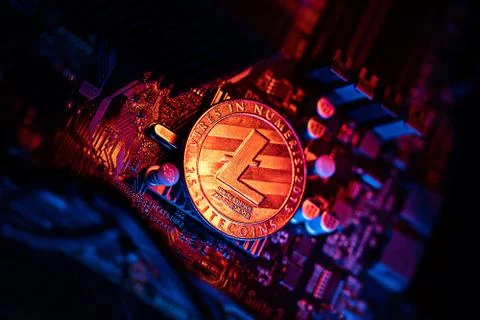 Litecoin Cryptocurrency coin on a PC computer motherboard, crypto currency mi Stockfoto's