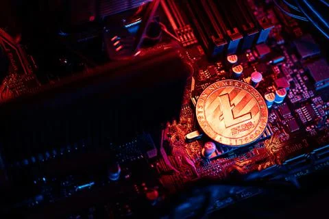 Litecoin Cryptocurrency coin on a PC computer motherboard, crypto currency mi Stockfoto's