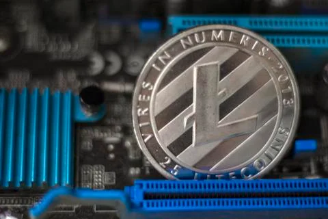 Litecoin on electronic computer processor board 写真素材