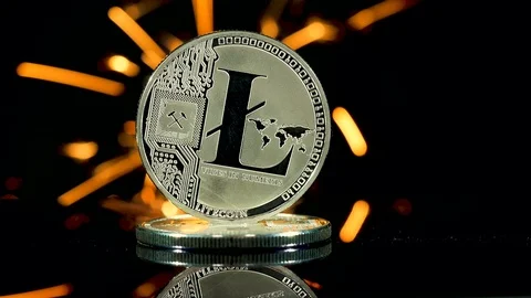 Litecoin front  side on black and sparks background Video stock 86790657