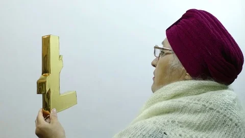 Litecoin is a peer-to-peer Internet currency. A woman looks at Litecoin. Stock Footage 83770744