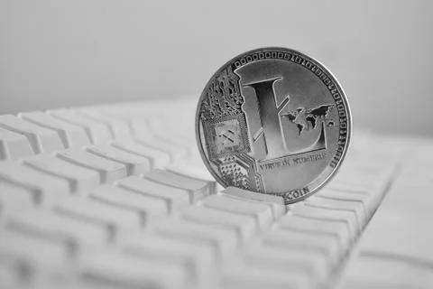 Litecoin on white keyboard Stock Photos