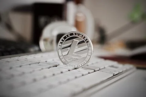 Litecoin on the white keyboard Stock Photos