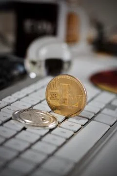 Litecoin on the white keyboard Stock Photos