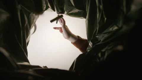 Lithium battery recycling. Hand throws batteries in the trash. view from inside Stock Footage 172419711