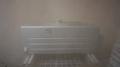 Lithium battery unit undergoing environmental mist or vapor testing in a chamber Stockbeeldmateriaal 156059469