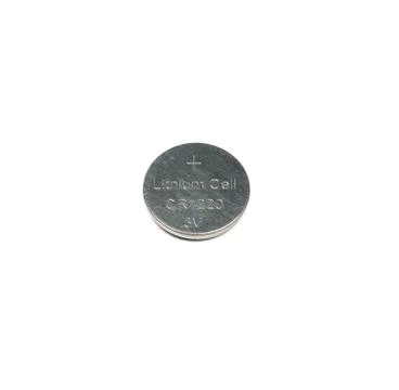 Lithium button cell battery isolated on white Foto stock