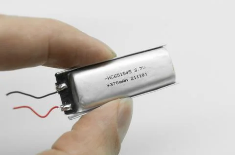 Lithium polymer battery on a white background. Compact small lithium battery for Stock Photos
