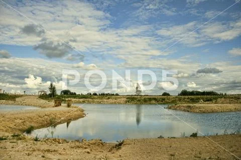 Lithuania lake with interesting clouds, Great Place to visit in Nature. Stock Photos