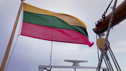 Lithuanian flag fluttering in the wind on an old sailboat. Slow notion video. Stock Footage 209640851