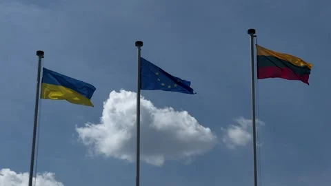 Lithuanian, Ukrainian and EU flags waving on the wind Stock Footage 246973033