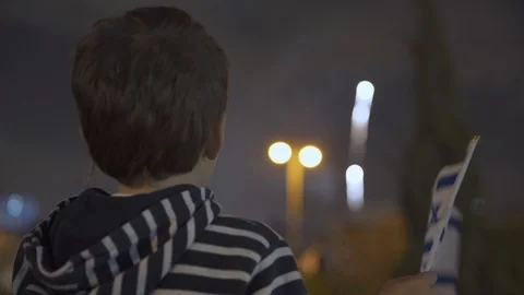 Litle boy looking at fireworks and Waving Israeli Flag, 스톡 동영상 108082472