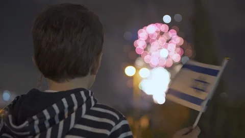 Litle boy looking at fireworks and Waving Israeli Flag, 스톡 동영상 108091709