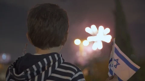 Litle boy looking at fireworks and Waving Israeli Flag, 스톡 동영상 108092562
