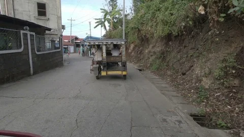 A litle car on the road in Philippines Stock Footage 109796813