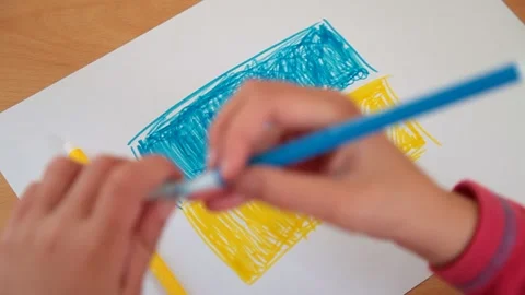 Litle child hand draws the flag of Ukraine Stock Footage 172572096