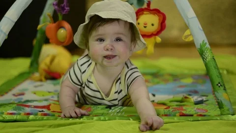 Litle kid. boy on the mat playing Stock Footage 114967891