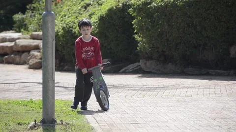 Litlle boy going with the bicycle Stock Footage 47599672