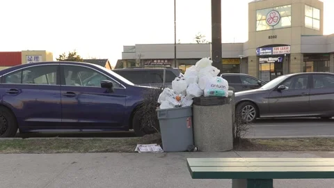 Litter and garbage cans overflowing pile up during COVID 19 pandemic Vídeo Stock 151674385