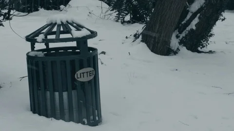 Litter Bin Covered During Falling Snow in Small South East London Park Stock Footage 98606989