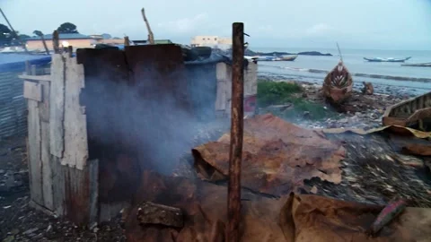 A littered ocean shore where local African fishermen live. Video contains noises Stock Footage 150273892
