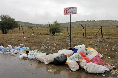 Littering of garbage in front of do not litter sign, Chile Stock Photos