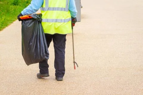 Litterpicker working to keep streets clean Stock Photos