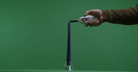 Litting a candle on green screen Stock Footage 102939021