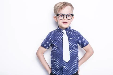 Little adorable kid in tie and glasses. School. Preschool. Fashion Stock Photos
