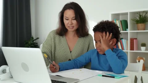 Little african boy doing homework at home Stock Footage 199608554
