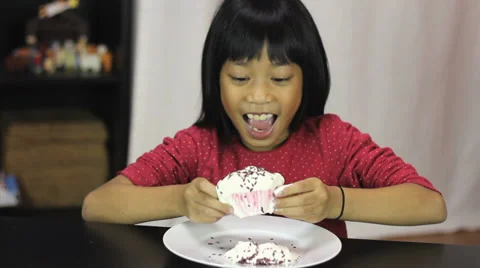 little girl eating cake