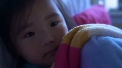 One tired little baby toddler wearing di, Stock Video