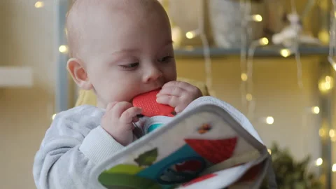 Little baby boy bitting a teether toy. Stock Footage 147258909