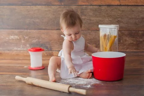 Little baby chef in apron. Stock Photos
