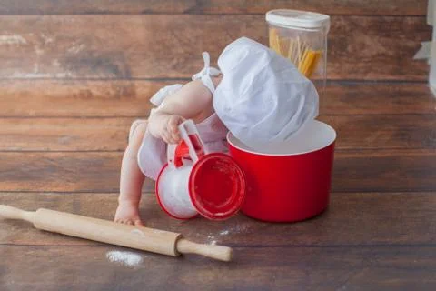 Little baby chef in apron. Stock Photos