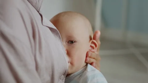 Little baby eats breast milk from mother. Healthy eating Stock Footage 303040344