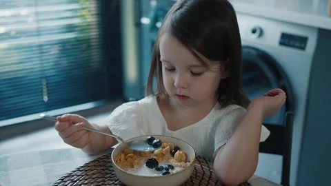 Little Baby Girl with Appetite Eats Morning Breakfast Stock Footage 254685553