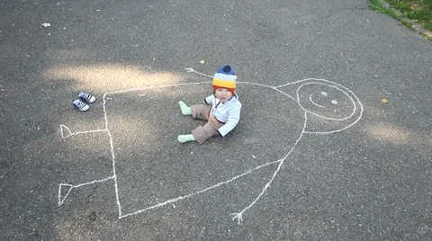 Little baby sitting on a aphalt drawned mother and nodding Stock Footage