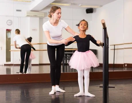 Little ballerina practicing choreographic elements Stockfoto's