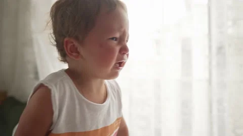 Little blond boy does not want to eat a meal that gives him a parent and cry Stock Footage 194989738