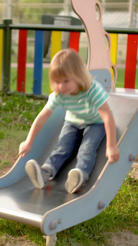 Little blonde boy having fun while sliding. Stock Footage 239267314