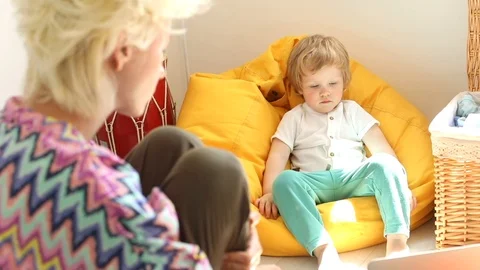 Little blonde boy using laptop at home having free time with mom 스톡 동영상 109130701