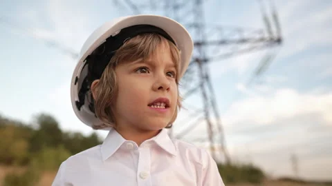 Little boy acting role of engineer or manager with safety helmet. Occupation in Stock Footage 294131066