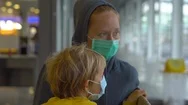 Little Boy And His Mother In A Medical Face Masks In An Airport Waiting For Stock Footage