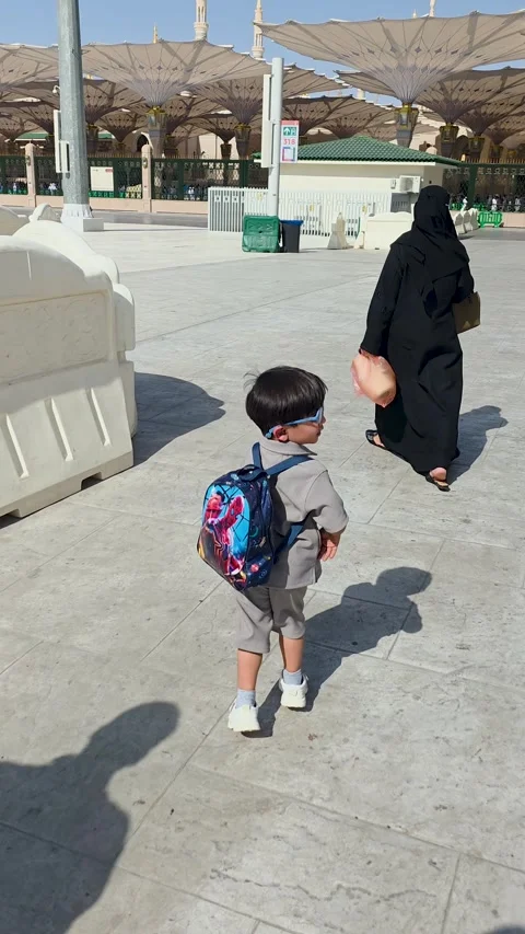 Little Boy with Backpack Walking at Prophets Mosque Stock Footage 346410127