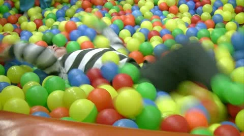 Little boy in ball pit 스톡 동영상 12636151