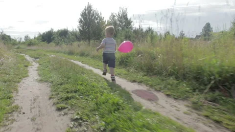 A little boy with a balloon Stock Footage 92148522