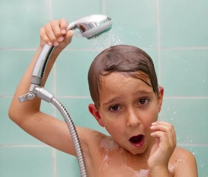 Little boy is bathed in the shower Stock Photos