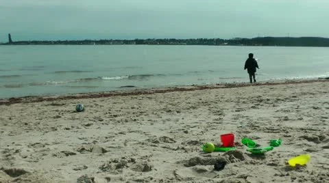 Little boy on the beach having fun Stock Footage 11864340